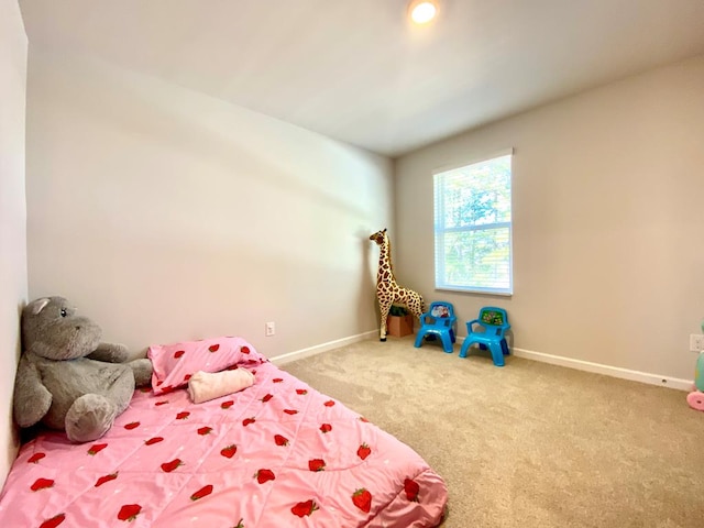 carpeted bedroom with baseboards