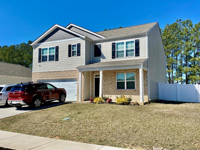 view of front facade featuring driveway, brick siding, an attached garage, and fence