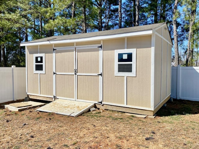 view of shed featuring a fenced backyard