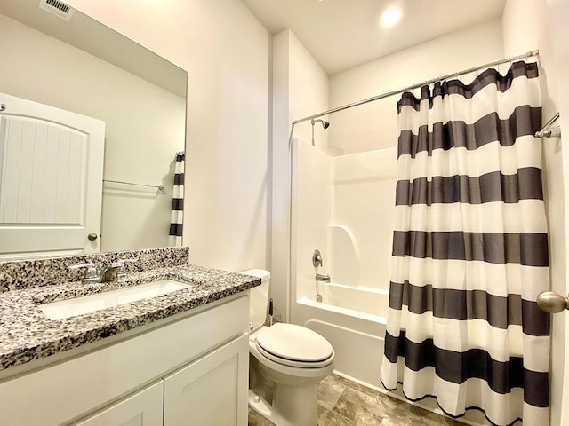 full bath with shower / tub combo, visible vents, vanity, and toilet