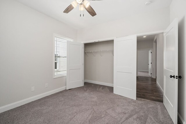 unfurnished bedroom featuring carpet floors, a closet, a ceiling fan, and baseboards