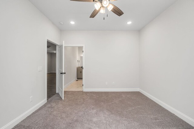 unfurnished bedroom with recessed lighting, light colored carpet, ceiling fan, and baseboards