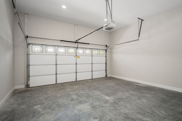 garage with recessed lighting, baseboards, and a garage door opener