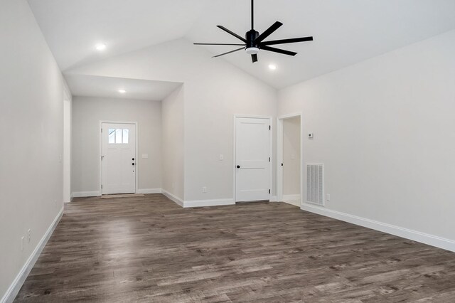 interior space featuring high vaulted ceiling, visible vents, baseboards, a ceiling fan, and dark wood-style floors