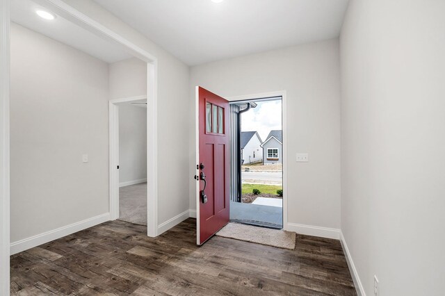 entrance foyer featuring dark wood-style floors and baseboards