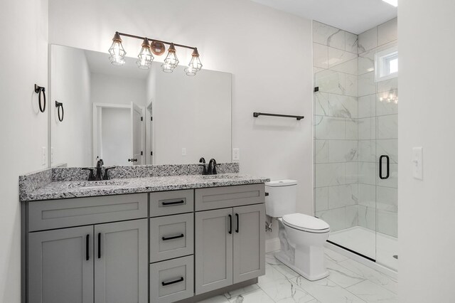 bathroom featuring double vanity, marble finish floor, a shower stall, and a sink