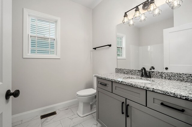 full bath featuring marble finish floor, visible vents, toilet, vanity, and baseboards