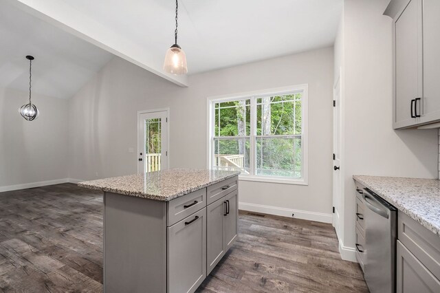 kitchen with light stone countertops, dishwasher, and gray cabinetry