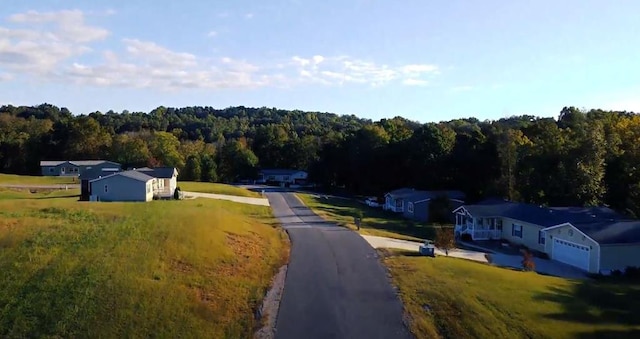 aerial view featuring a wooded view