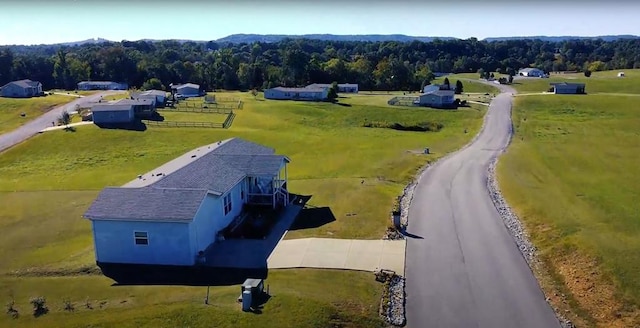 drone / aerial view with a rural view and a forest view