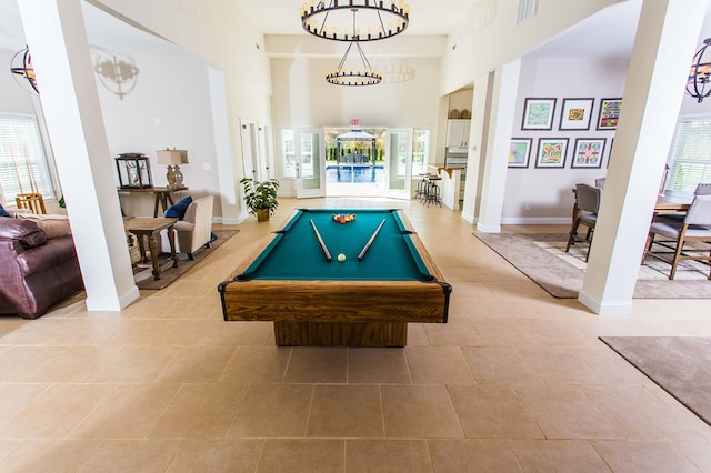 recreation room featuring a wealth of natural light, pool table, visible vents, and a towering ceiling