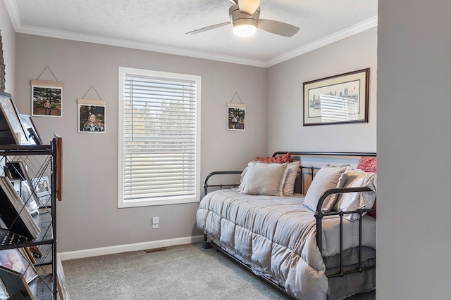 carpeted bedroom with crown molding, multiple windows, and baseboards