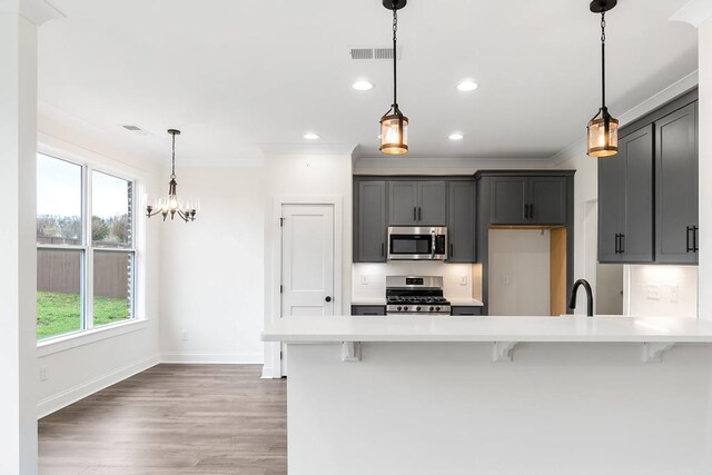 dining room with a notable chandelier, dark wood-type flooring, baseboards, a raised ceiling, and crown molding