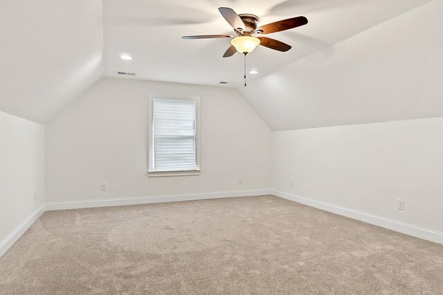 bedroom featuring carpet, crown molding, a raised ceiling, ceiling fan, and baseboards