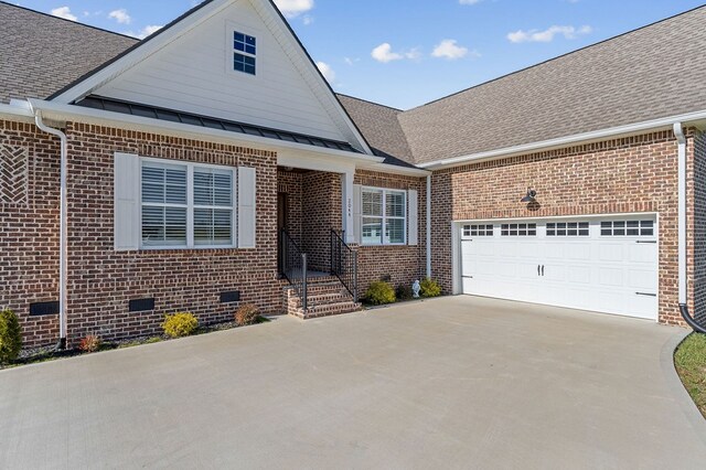 view of front of property featuring a shingled roof, crawl space, and brick siding