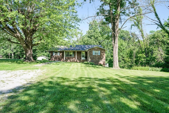 view of front of house featuring a porch and a front yard