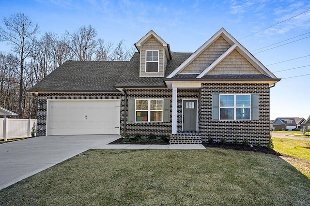 view of front of property with a garage, driveway, a front yard, and brick siding