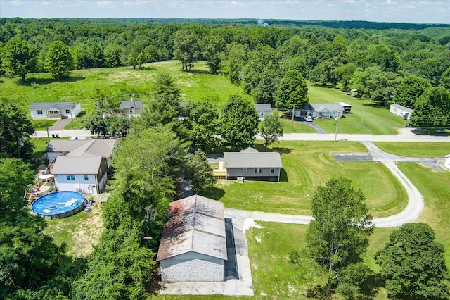 bird's eye view featuring a residential view and a view of trees