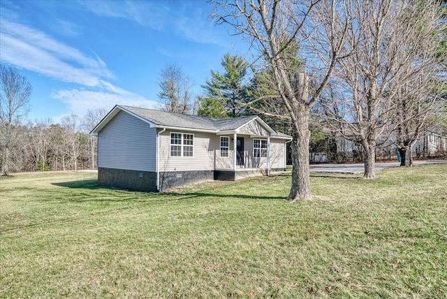 ranch-style home featuring a porch, a front yard, and crawl space