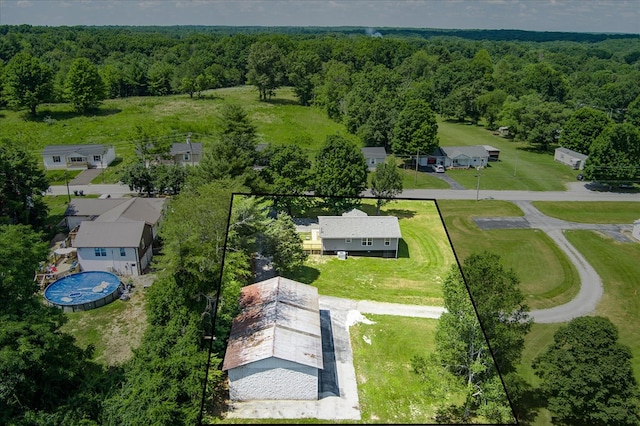 birds eye view of property with a residential view and a view of trees