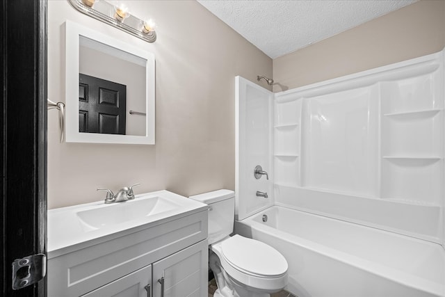 full bathroom with toilet, vanity, a textured ceiling, and bathing tub / shower combination