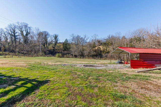 view of yard with a rural view