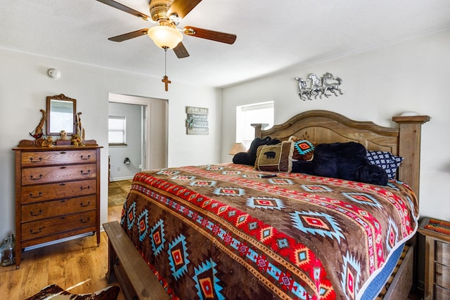 bedroom featuring ceiling fan and wood finished floors