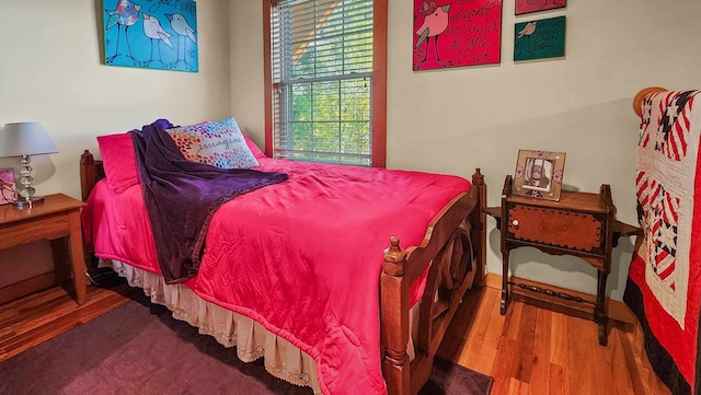 bedroom featuring wood finished floors