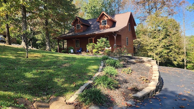 view of front of home featuring a front yard and covered porch