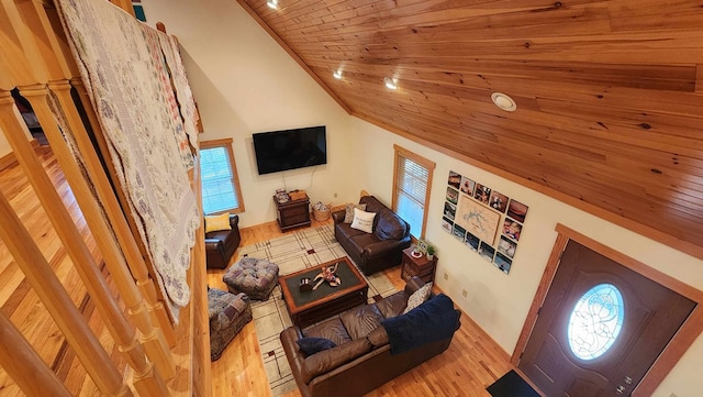 living room with wood finished floors, wood ceiling, and vaulted ceiling