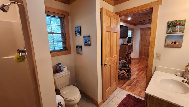 full bathroom with vanity, baseboards, tile patterned floors, toilet, and wooden ceiling