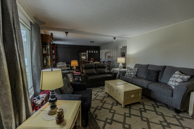 living area featuring light carpet and a textured ceiling