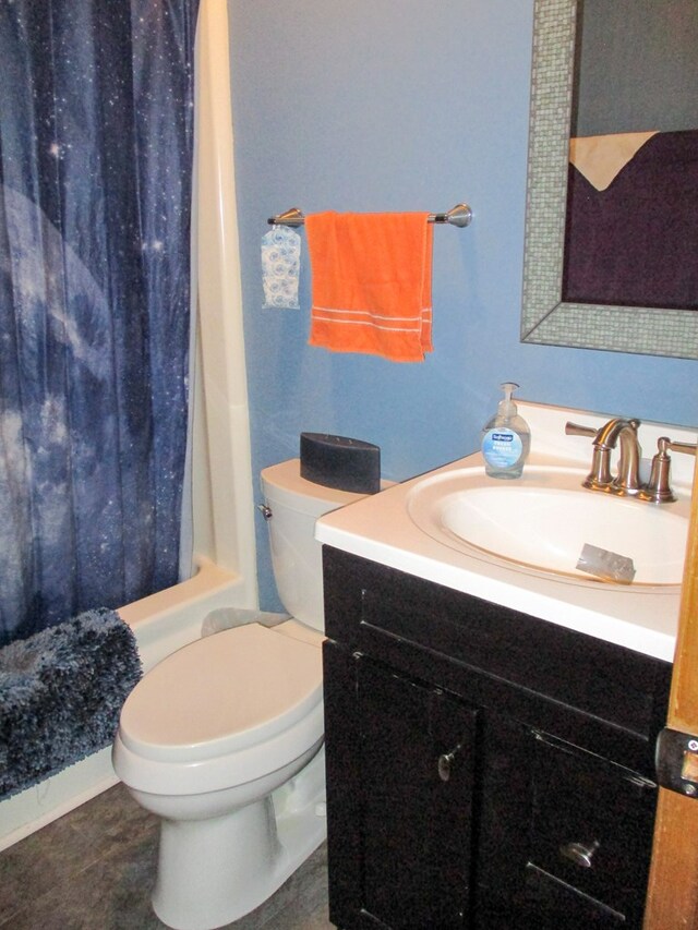 bathroom featuring toilet, tile patterned flooring, vanity, and shower / tub combo with curtain