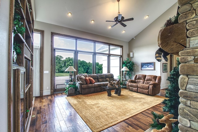 living area with high vaulted ceiling, dark wood-type flooring, a ceiling fan, and recessed lighting