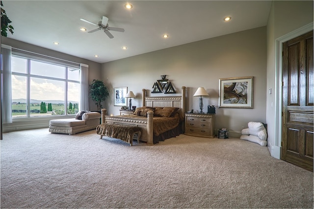 carpeted bedroom with vaulted ceiling, ceiling fan, and recessed lighting