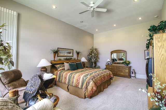 bedroom with ceiling fan, recessed lighting, baseboards, and light colored carpet