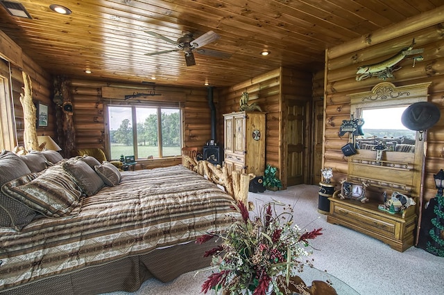 bedroom featuring recessed lighting, wooden ceiling, a wood stove, and light colored carpet