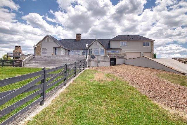 view of yard with a garage and fence