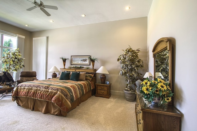 bedroom featuring recessed lighting, light colored carpet, ceiling fan, and baseboards