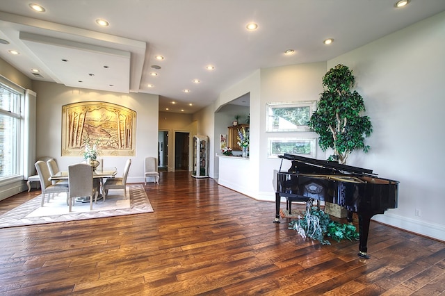 dining space with dark wood-type flooring, recessed lighting, and baseboards