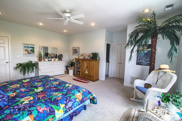 bedroom featuring recessed lighting, visible vents, ceiling fan, and light carpet