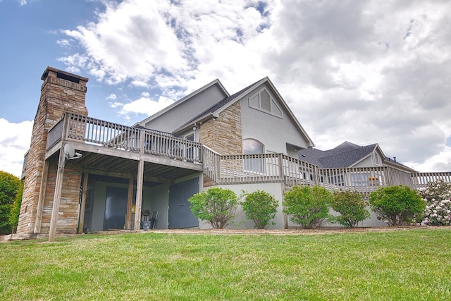 exterior space featuring stone siding, a deck, a lawn, and stucco siding