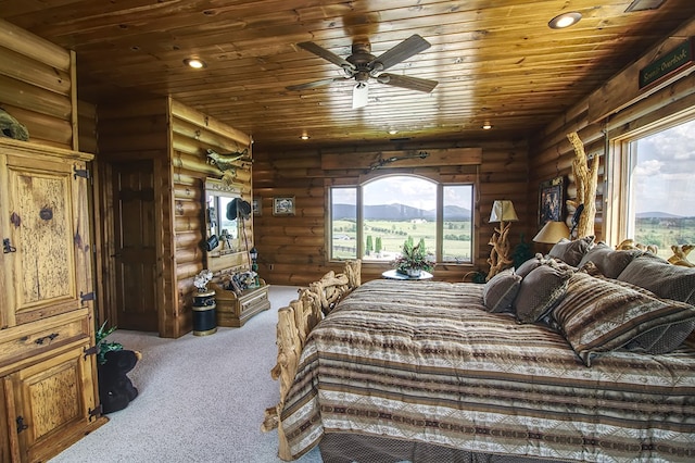 bedroom featuring wooden ceiling, recessed lighting, a mountain view, and light colored carpet