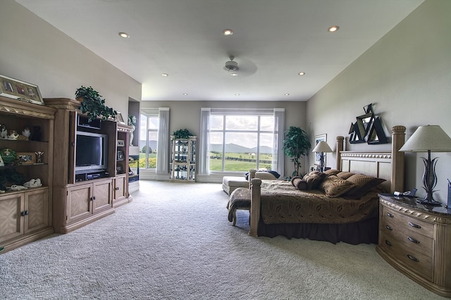 bedroom featuring light carpet and recessed lighting