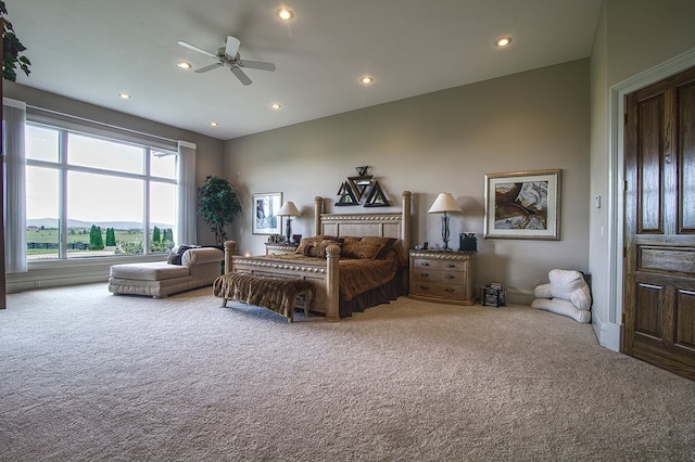 carpeted bedroom featuring lofted ceiling, a mountain view, a ceiling fan, and recessed lighting