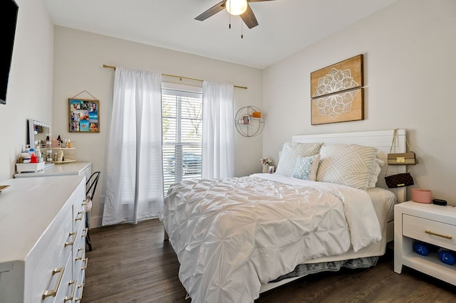 bedroom featuring dark wood-style floors and ceiling fan