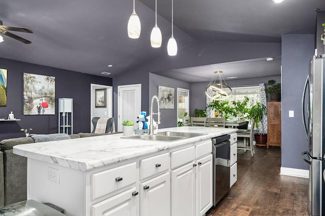 kitchen featuring dark wood-type flooring, freestanding refrigerator, open floor plan, a sink, and vaulted ceiling