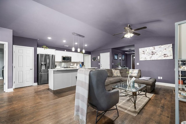 living area featuring lofted ceiling, dark wood-style floors, baseboards, and a ceiling fan