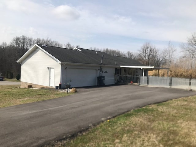 exterior space with an attached garage and driveway