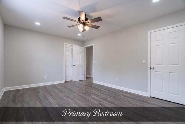 unfurnished bedroom with a ceiling fan, recessed lighting, dark wood finished floors, and baseboards